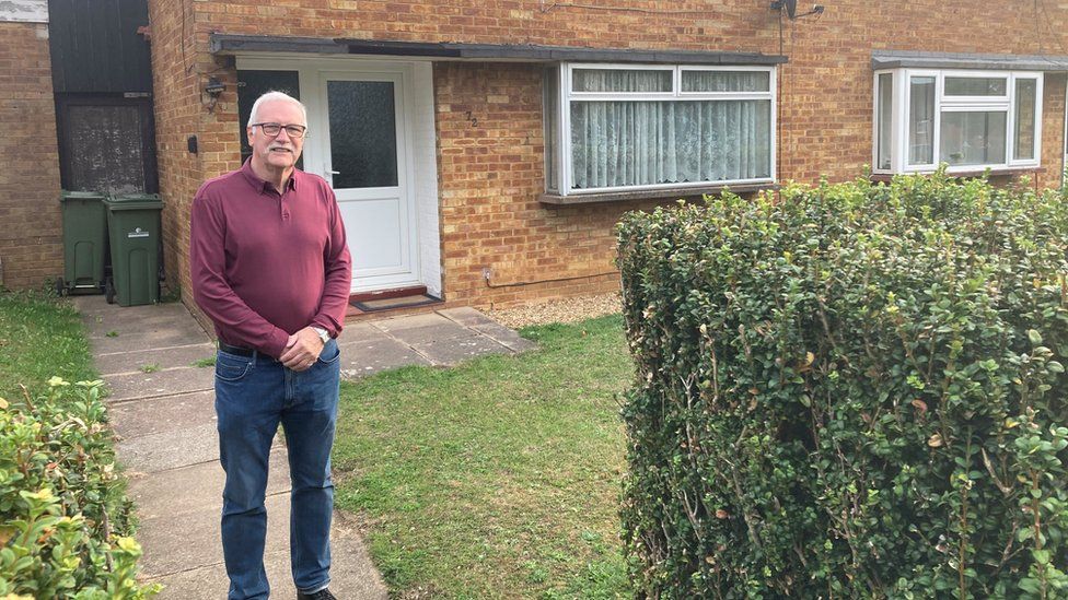 Colin Spence outside his former home in Bletchley