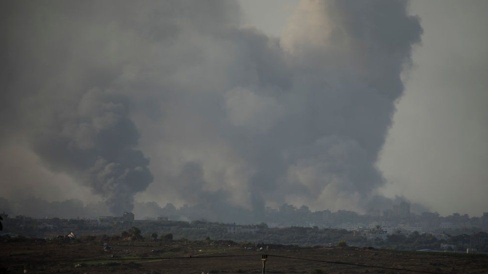Smoke rises over the Gaza Strip as seen from the Israeli side of the border on December 26, 2023 in Southern Israel