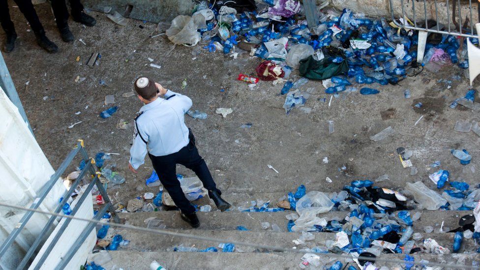 A police officer walks at the scene