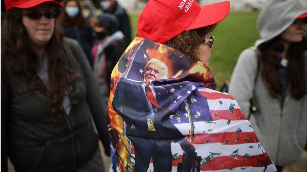 Thousands of supporters stand in line hoping to attend a campaign rally with U.S. President Donald Trump at Capital Region International Airport October 27, 2020 in Lansing, Michigan.