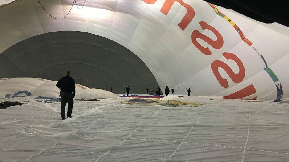 Man standing inside the world's biggest balloon