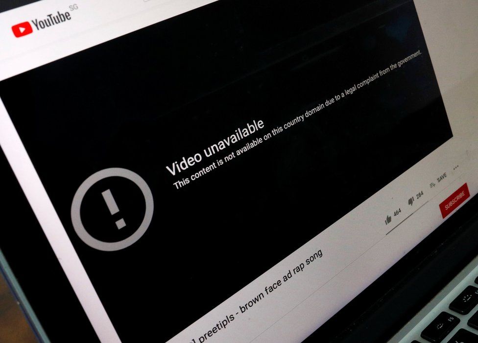 Computer screen with YouTube video of rap open, with the message: This content is not available on this country domain due to a legal complaint from the government