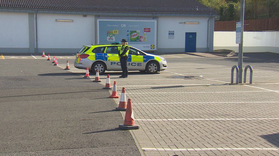 Police in the supermarket car park