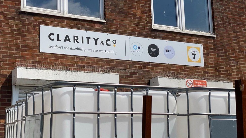 Image of the sign and entrance to the Clarity factory in east London