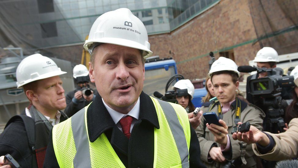 Steve Green pictured in high-viz and hard hat at the site of his planned museum