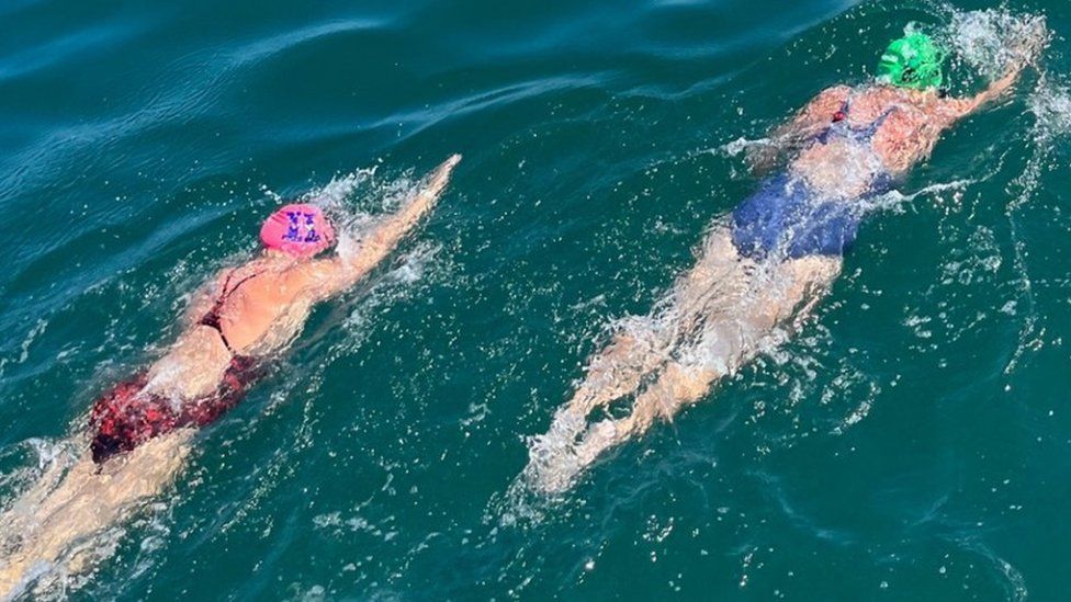Lee Saudan and Laura Reineke training sea swim 