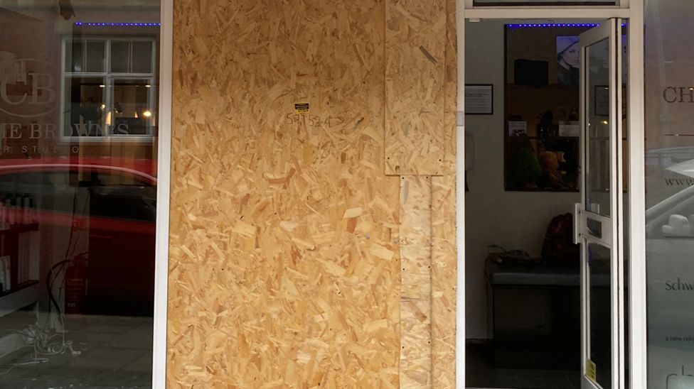 Shop windows smashed in overnight attacks - BBC News