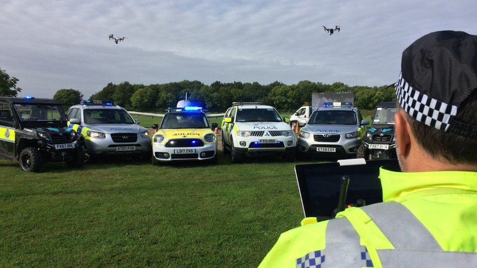 Police officer flying a drone