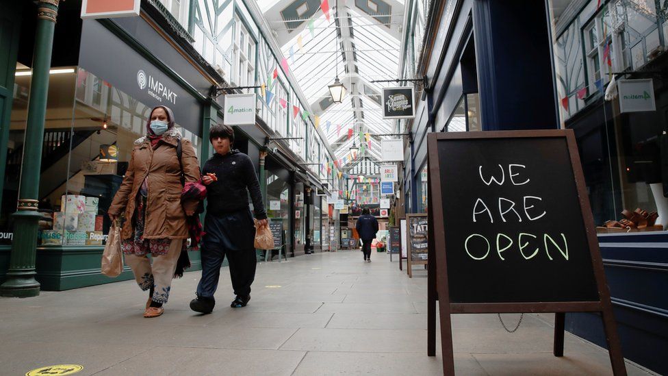 People walk at The Arcade shopping mall, amid the spread of coronavirus disease (COVID-19), in Bedford town centre,