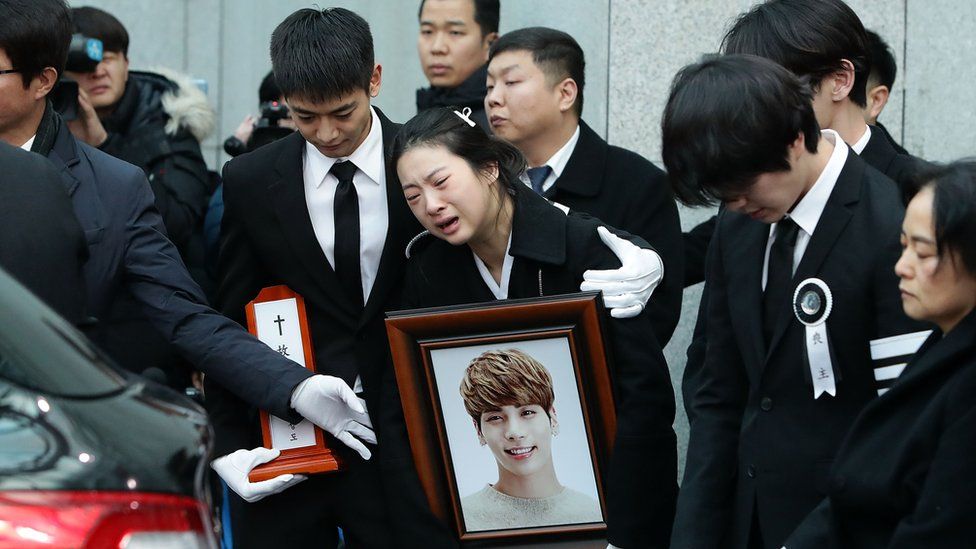 Relatives weep during the funeral of Jonghyun of SHINee at the hospital on December 21, 2017 in Seoul, South Korea. The lead vocal of K-pop idol found dead, thought to have committed suicide at his apartment on December 18.