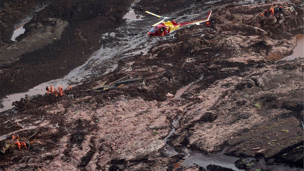 Rescuers search for missing people after the collapse of the dam in Brazil
