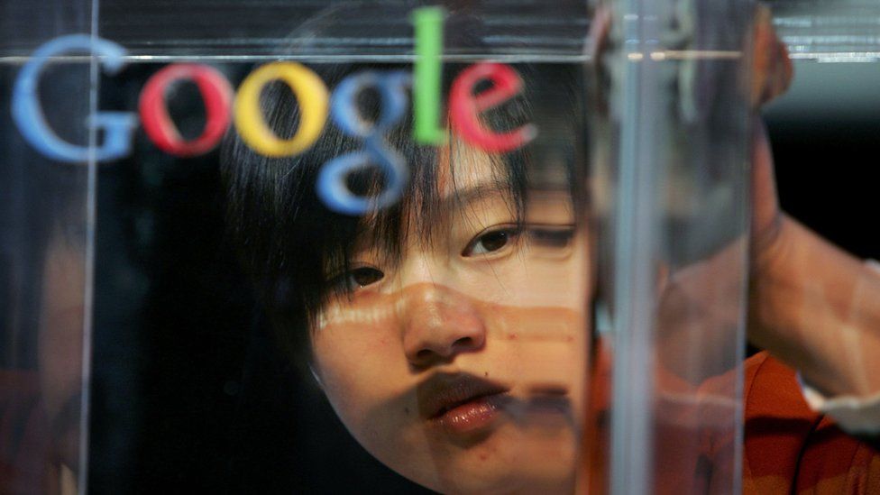 A Chinese woman's face appears behind a Google logo