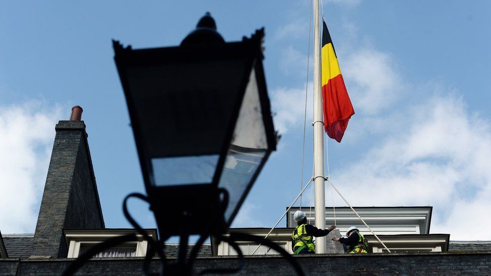 The Belgian flag flies at half mast above 10 Downing Street in London