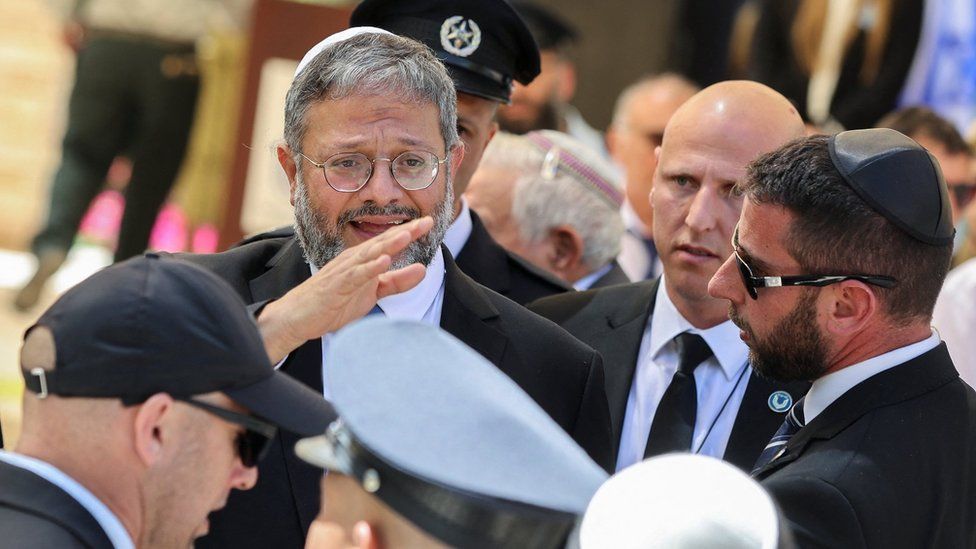 File photo showing Israeli National Security Minister Itamar Ben-Gvir (left) waving as he attends an event for Israel's Memorial Day in Beersheba (25 April 2023)