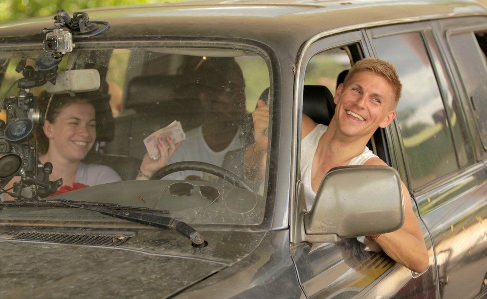 Vicky, Mary and Steve in the car they travelled through Vietnam in