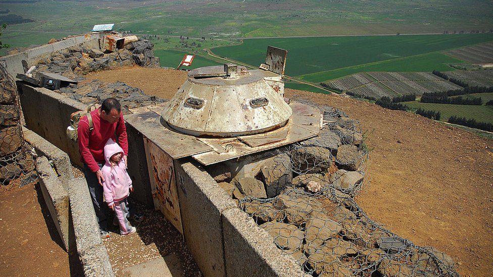 Tourists visit an old Israeli military post on the Golan Heights (file photo)