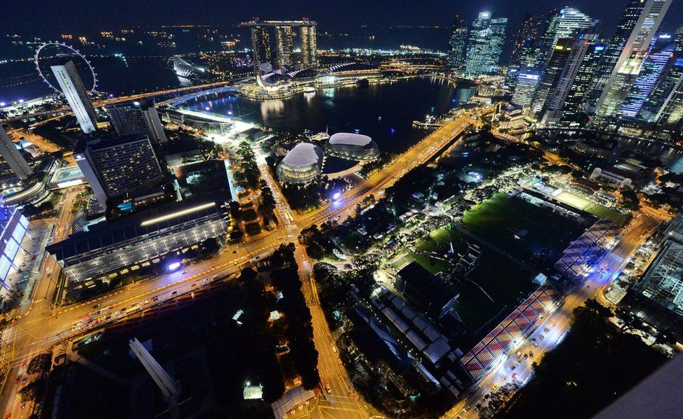 An aerial view of Singapore lit up at night