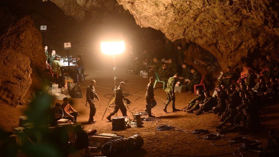 Thai soldiers gather in Tham Luang cave