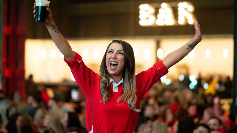 Woman celebrates during Six Nations game