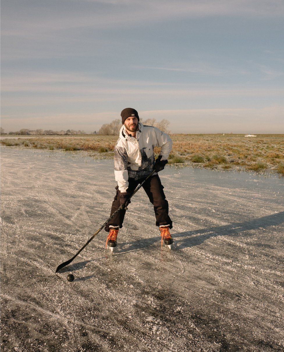 Max, an ice hockey player, prepares for some practice on the frozen fen