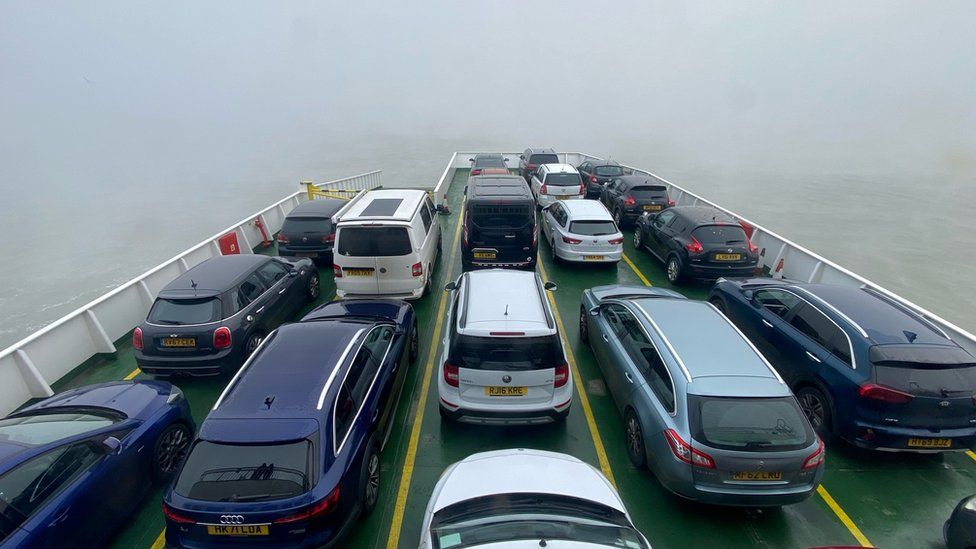 Vehicle ferry in fog