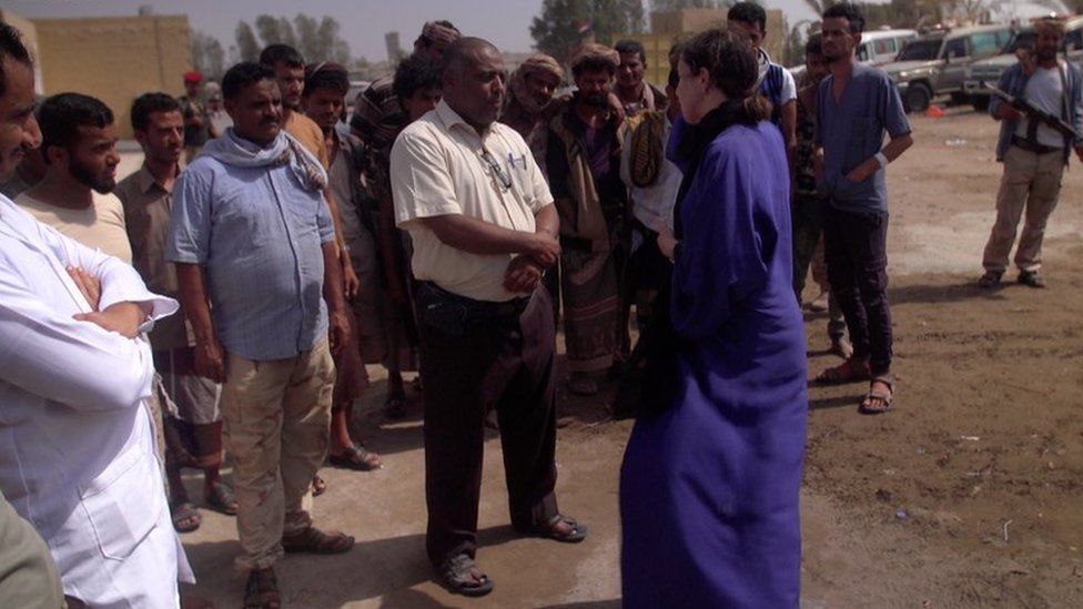 Lyse Doucet speaks to people outside a hospital in western Yemen