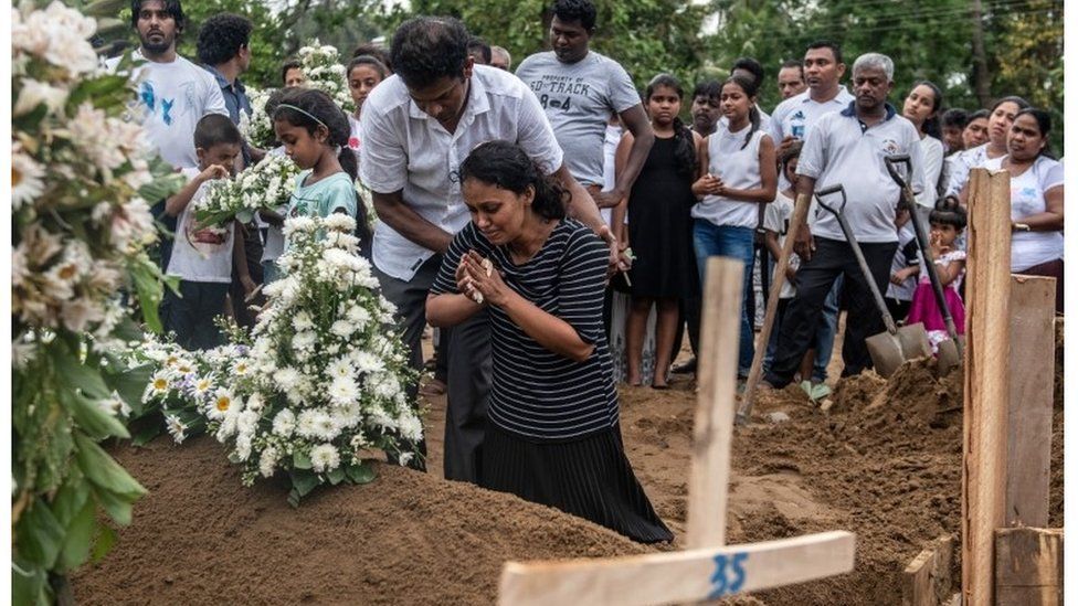 A woman grieves in the aftermath of the Easter Sunday bombings in Sri Lanka, 25 April 2019