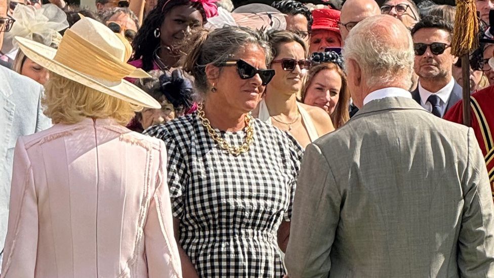 Tracey Emin speaking to the King and Queen at a Buckingham Palace garden party