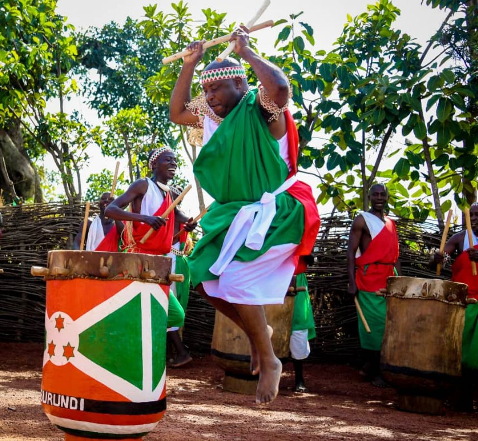 Burundi's President Evariste Ndayishimiye jumping in the air as he plays the royal drums at the sanctuary in Gishora, Burundi - Wednesday 19 January 2022