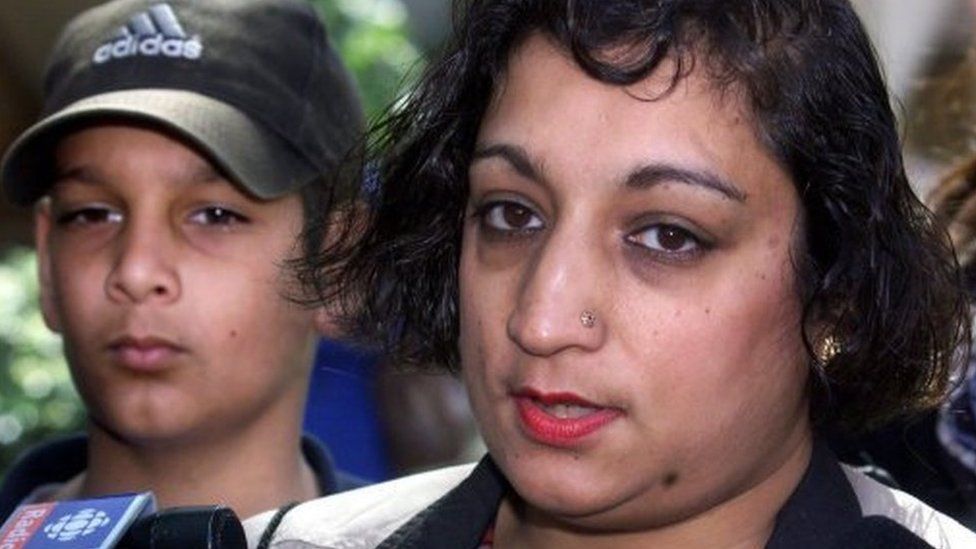 Suman Virk and her son Aman talk to reporters outside court in Vancouver on 20 April 2000 following the sentencing of Kelly Ellard who was convicted in the killing of Reena Virk