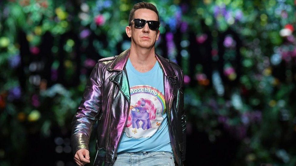 US designer Jeremy Scott greets the audience at the end of the show for fashion house Moschino during the Women's Spring/Summer 2018 fashion shows in Milan, on September 21, 2017