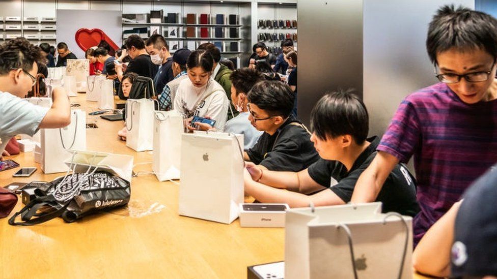 Customers activate new iPhone 11 series smartphones after purchase at an Apple retail store on East Nanjing Road in Shanghai. Apple launched sales of its latest iPhone 11 series in China.