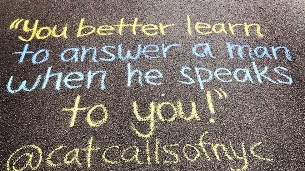 A catcall reading: "You better learn to answer a man when he speaks to you" written on the ground