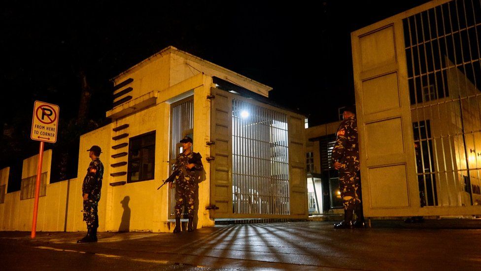 Filipino soldiers stand guard outside a government facility following the declaration of Martial Law