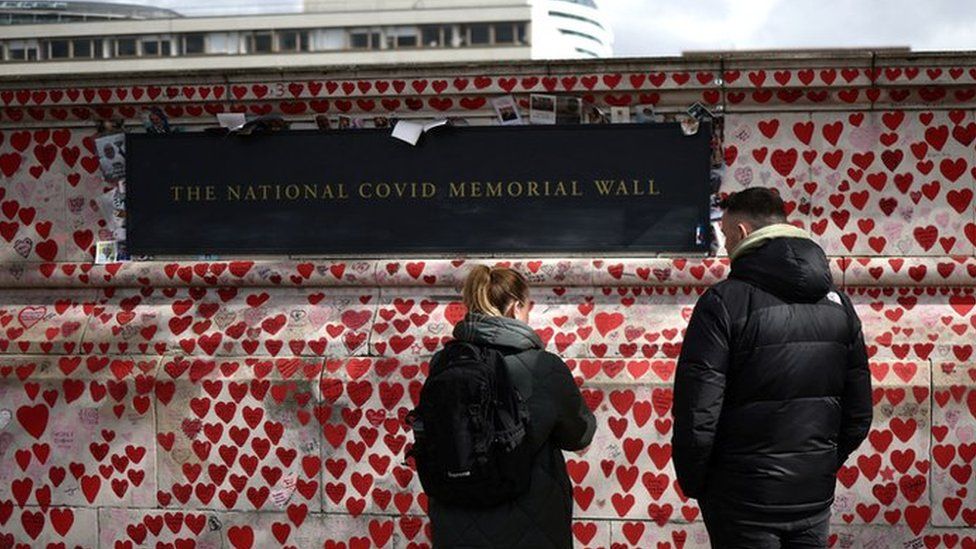 Visitors to The National Covid Memorial Wall, on the third anniversary of the UK's first national lockdown, in March 2023