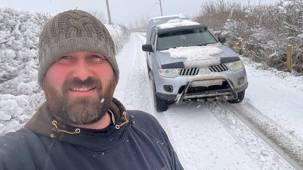 Ben Owen and his vehicle in the snow