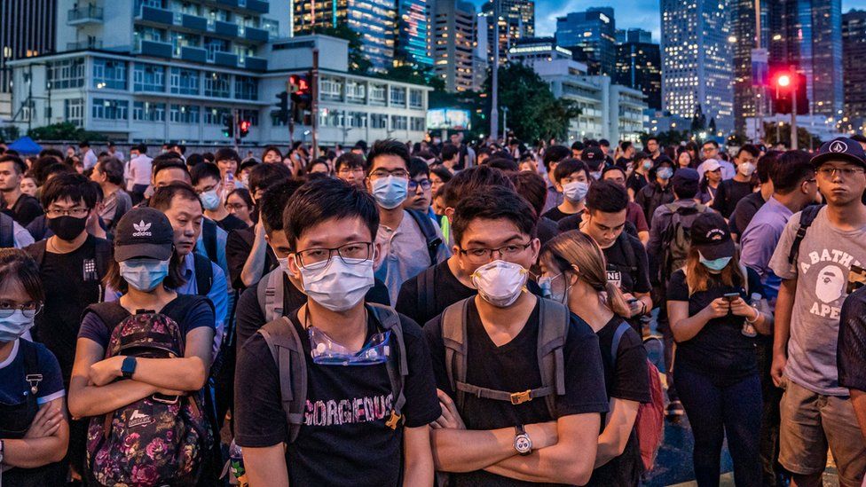 Protesters (protestors, demonstrators) occupy a street demanding Hong Kong leader to step down after a rally against the now-suspended extradition bill outside of the Chief Executive Office on June 17, 2019 in Hong Kong China