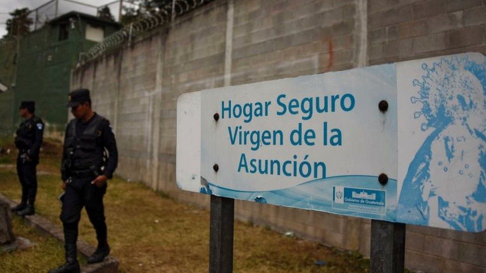 Police agents guard the entrance of Virgen de la Asuncion children's shelter after 40 girls died during a fire on March 8, in San Jose Pinula, about 10 km east of Guatemala City on March 15, 2017.