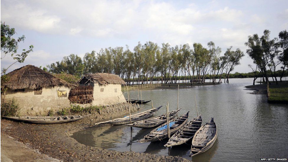 Boats are seen at a village near the Sunderbans in Khulna, some 350 kms southwest of Dhaka, on March 31, 2009.