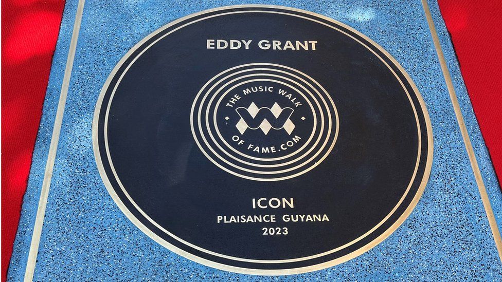 A stone that reads Eddy Grant