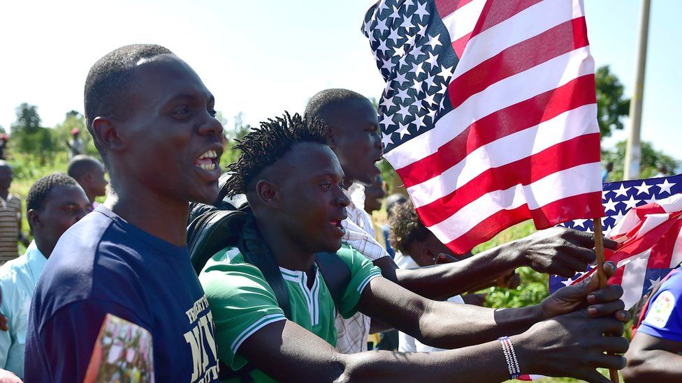 Kenyans with US flags in Kogelo, Kenya - Monday 16 July 2016