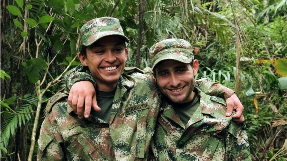 A handout photo released by Colombian Defensoria del Pueblo shows two Colombian professional soldiers Kleider Antonio Rodriguez (L) and Andres Felipe Perez posing after being released by the ELN guerrillas in Arauca, Colombia, 16 November 2015