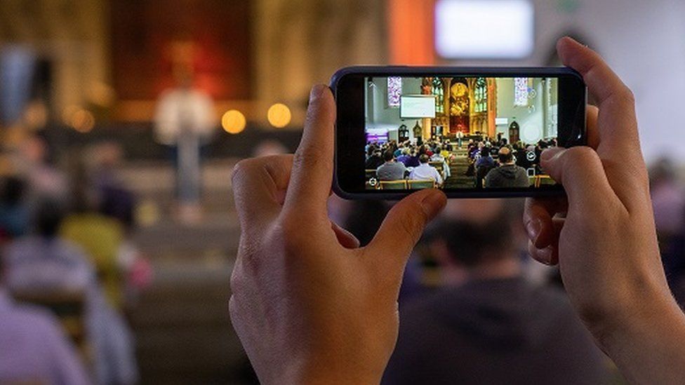 mobile phone being used in church