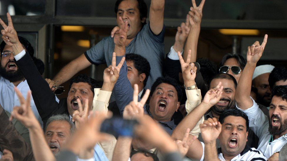 Opposition supporters celebrate after a Supreme Court verdict against Pakistan's Prime Minister Nawaz Sharif in Islamabad, 28 July 2017