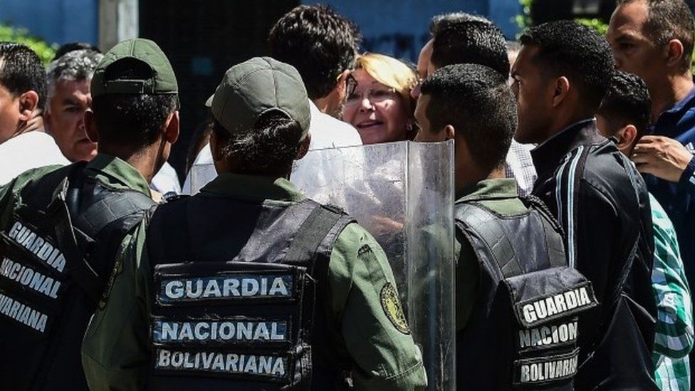 Venezuela's chief prosecutor Luisa Ortega (C) is surrounded by people and national guards during a visit to the Public Prosecutor's office in Caracas on August 5, 2017