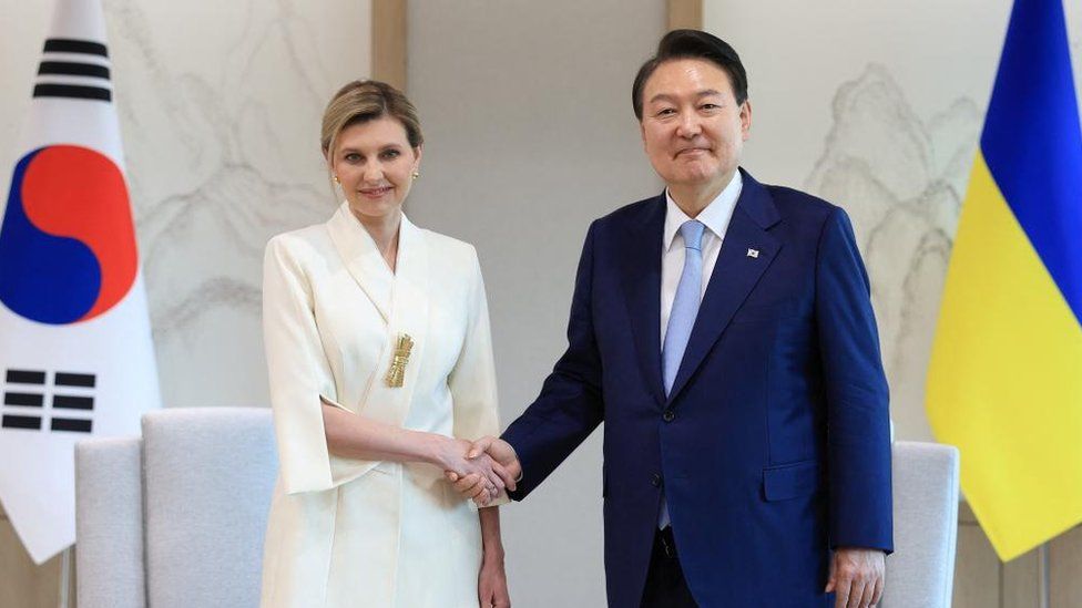 South Korean President Yoon Suk-yeol shakes hands with Ukraine's first lady Olena Zelenska at the Presidential Office in Seoul, South Korea, May 16, 2023.