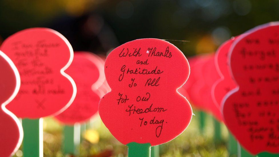 Poppies with messages are seen next to the Menin Gate Memorial in Ypres at the Menin Gate Memorial in Ypres
