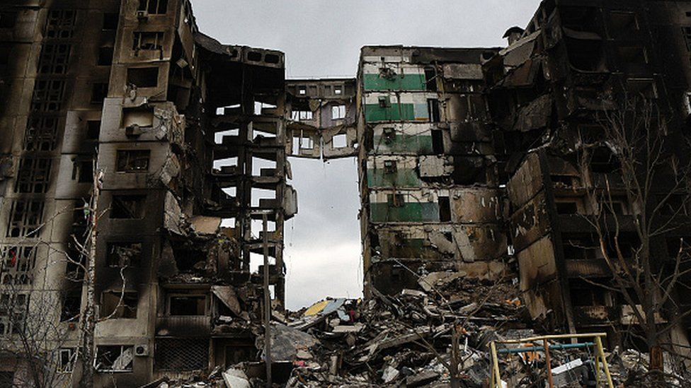 Remnants of an apartment building in Borodyanka litter the ground after the Russian invasion of Ukraine.