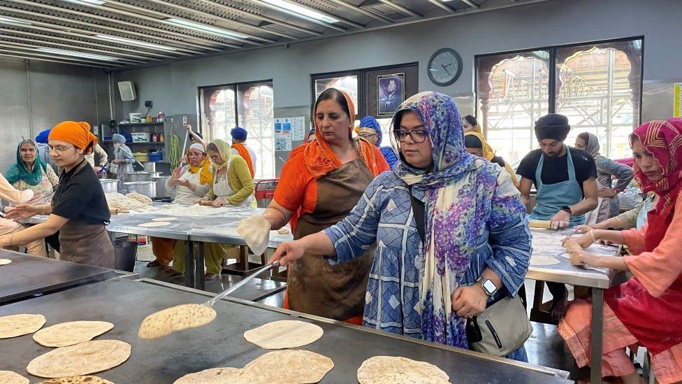 Women making food at the Gurdwara.