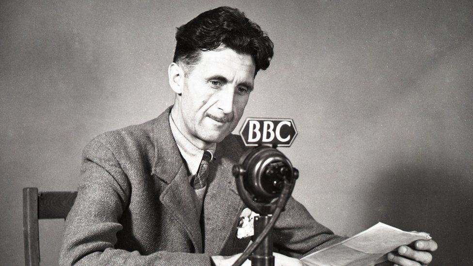 George Orwell in front of a BBC microphone